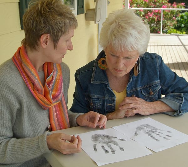 Lindy and Arlene looking at prints